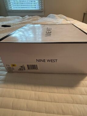 Nine West high heel with embroidered heel.